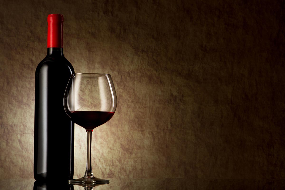 photodune-1930437-bottle-with-red-wine-and-glass-on-a-old-stone-m
